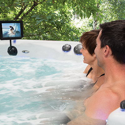 A Couple enjoying their iPod 'Cinema' in their H2X Swim Spa